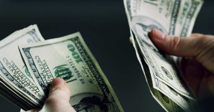 Hands,,Person,And,Counting,Cash,For,Fraud,Crime,,Money,Laundering Hands holding and counting stacks of cash