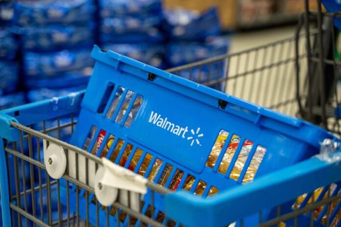 Close,Up,Of,Blue,Walmart,Shopping,Basket,Inside,Cart.,Toronto, Blue shopping basket in a cart at a supermarket aisle