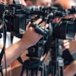 Parents Blindsided — Retirement Plans Derailed television cameras on tripods at a media event