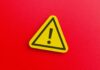 Killer Mosquito Sneaks In — Two Workers Dead Yellow warning sign with exclamation mark on red background