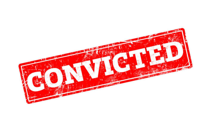 Convicted,Written,On,Red,Rubber,Stamp,With,Grunge,Edges. Red stamp with the word 'CONVICTED' in bold white letters