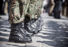 Troops Ordered To Refuse Row of soldiers in black boots and camouflage pants standing in formation