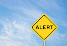 BLACKLIST: Regulators Sound Alarm Yellow alert sign against a blue sky