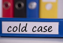 Cold-Case Shock: Suspect Back In Cuffs (VIDEO) Blue binder labeled 'cold case' with other colored binders in the background
