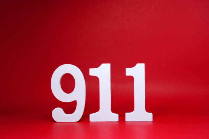 White numbers 911 on a red background