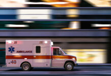 Bus Flips – Kids Trapped, Two Dead (VIDEO) Ambulance driving through city street at speed