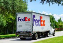 FedEx freight truck driving down a suburban street