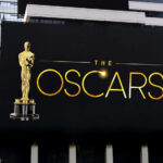 Oscars billboard on a city building exterior wall