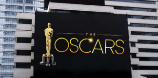 Oscars billboard on a city building exterior wall