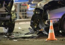Red Light Smash Jolts Campaign Car crash scene with two damaged vehicles and an orange traffic cone