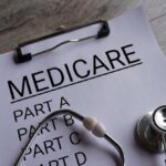 Clipboard with Medicare document and stethoscope on a desk