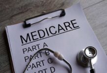 Clipboard with Medicare document and stethoscope on a desk