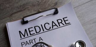Clipboard with Medicare document and stethoscope on a desk