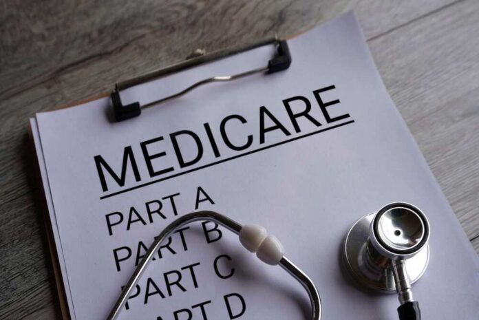 Clipboard with Medicare document and stethoscope on a desk
