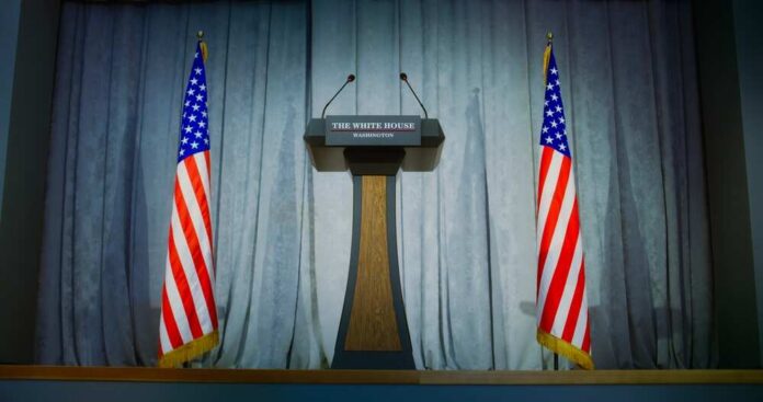 Tribune,For,Politician,,Congressman,Or,Us,Minister,Political,Speech,In Podium between two American flags on a stage
