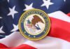 Judge Vs DOJ Firing Showdown Department of Justice seal on an American flag background