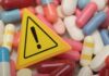Shocker: Pills Link Deaths Warning sign among assorted pills and capsules