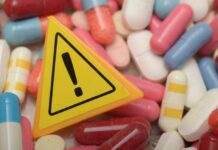 Shocker: Pills Link Deaths Warning sign among assorted pills and capsules
