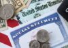 Retiree Pay Twist Lands A collection of financial documents including a Social Security card, cash, and coins