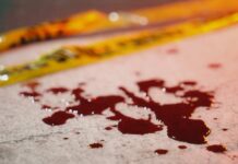 Balcony Horror: Mother, Baby Plunge (Video) Blood droplets on pavement near yellow caution tape