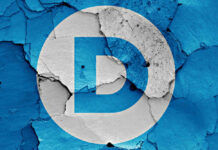 DHS BOMBSHELL: Democrat Targeted Democratic Party logo on a cracked, peeling surface.