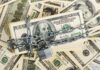 Paychecks Exposed – Treasury Slams Brakes A stack of hundred dollar bills secured with a chain and padlock
